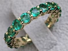 Stunning 3 carat certified emerald low set 14K yellow gold band setting. Band features 19 round cut, natural green emerald of 3.5mm. The ring is meticulously handcrafted with great care and attention to every detail. Ask me anything on live chat! http://bit.ly/DiamondsMineChat In order to make your decision easier we offer: ♥ FREE FedEx or USPS Shipping - Sent With a Tracking Number ♥ FREE Luxury Gift Box ♥ FREE Certificate of Authenticity & Appraisal ♥ 14 Days Money Back Guarantee - No Ques Emerald Eternity Ring, Emerald Eternity Band, Emerald Wedding Band, Emerald Rings, Bespoke Engagement Ring, Emerald Wedding, Art Deco Diamond Rings, Aquamarine Engagement Ring, Rose Gold Diamond Ring