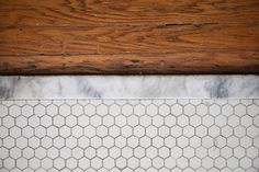 white marble and wood tile on the floor