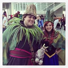 two people dressed up in costumes at an event