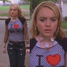 the blonde haired woman is wearing an i heart t - shirt and black leather pants