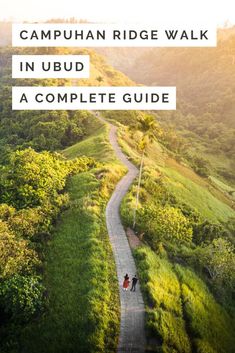 two people walking down a path with the words, campus ridge walk in ubud a