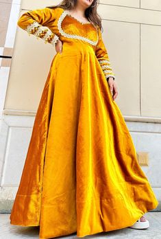 Hand made  Delivery from a small business in India  Feel traditional throughout your event wearing our mustard yellow velvet gown  Gown made in different types of laces and little bit of hand work  This gown can become a great part of wedding and wedding events Product details  Colour:- mustard yellow  Fabric:- velvet  Floor length  Type:- gown  Package contains:-1 hand work gown Model wearing:- S size Model height:- 5'4/ 162.56cm Size chart  XS (US Size) Shoulder:- 13-14 Bust:- 31-33 Waist:- 26-27 Hip:- 36-37 S (US Size) Shoulder:- 14-15 Bust:- 34-35 Waist:- 28-29 Hip:- 38-39 M (US Size) Shoulder:- 15-16 Bust:- 36-37 Waist:- 29-30 Hip:- 39-40 L (US Size) Shoulder:- 15-16 Bust:- 38-40 Waist:- 31-32 Hip:- 40-42 XL(US Size) Shoulder:- 16-17 Bust:- 40-42 Waist:- 33-34 Hip:- 42-44 XXL (US Size Gold Velvet Lehenga For Wedding, Traditional Long Sleeve Yellow Gown, Yellow Dabka Wedding Dress, Elegant Yellow Gown With Pallu, Yellow Party Gown With Dabka Work, Yellow Long Sleeve Party Gown, Gold Velvet Dress For Festive Occasions, Gold Anarkali Gown With Long Sleeves, Elegant Yellow Gown