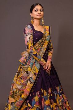 Purple attached cancan lehenga with ajantha concept kalamkari hand painted patterns. Paired with  padded purple blouse embroidered with glass beads and yellow hand painted dupatta with contrast border. - Aza Fashions Multicolor Dola Silk Pre-draped Saree For Wedding, Multicolor Chanderi Pre-draped Saree For Wedding, Wedding Multicolor Dola Silk Pre-draped Saree, Purple Chanderi Lehenga With Motifs, Multicolor Wedding Pre-draped Saree With Cutdana, Semi-stitched Purple Lehenga With Motifs, Designer Purple Lehenga With Motifs, Bollywood Style Purple Lehenga With Motifs, Purple Bollywood Lehenga With Motifs