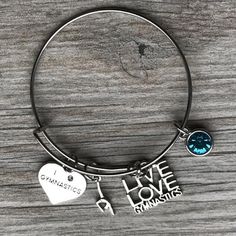 Custom Gymnastics Charm Bangle Bracelet with Inital -Perfect Gymnastics Gift!!! WHO LOVES GYMNASTICS?! Spread and Express your Pride for Gymnastics with this handmade personalized charm bracelet. This listing is for one custom gymnast charm bracelet. Absolutely adorable, you'll be in a hurry to show it off to your friends and family! PERSONLAIZE- create a unique custom gift by adding a birthstone charm. GYMNASTICS JEWELRY- Gymnastics Live Love Charm Bangle Bracelet - Perfect Gift for Girls and W Gymnastics Jewelry, Love Bangle, Gymnastics Gifts, Bangle Bracelets With Charms, Love Charms, Gift For Girls, In A Hurry, Charm Bangle, Birthstone Charms