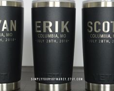 three black and silver tumblers with names on them