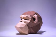 an origami gorilla head sitting on top of a table