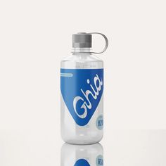 a blue and white water bottle sitting on top of a table