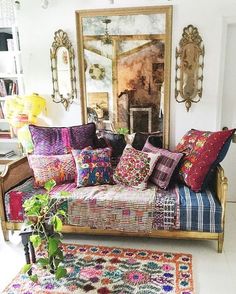 a living room filled with lots of colorful pillows