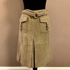 Etcetera Suede Skirt With Buckle Details. Lined. Front Pleat. Side Zip. Hits At Knee On 5’ 7” Female. Never Worn Elegant Fitted Cargo Skirt For Spring, Fitted Knee-length Cargo Skirt With Lining, Belted Knee-length Beige Skirt, Skirt With Buckle, Suede Skirt, Side Zip, Womens Skirt, A Line, Buckle