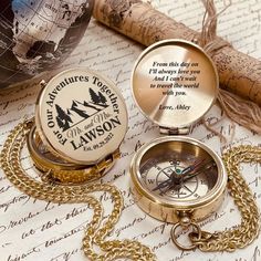 two pocket watches sitting on top of a map