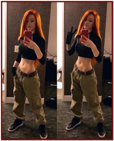 a woman with orange hair taking a selfie in front of a mirror wearing cargo pants