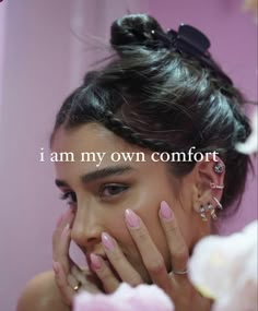 a woman with her hands on her face and the words i am my own comfort