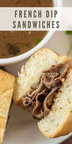 a sandwich cut in half sitting on top of a white plate next to a cup of soup