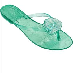 An Oversized Metallic Bow Sparkles Atop A Simple Flip-Flop Molded From Fruit-Scented Pvc. Melflex Pvc Is Durable, Flexible, Hypoallergenic And Recyclable Melflex Pvc Upper, Lining And Sole Made In Brazil Green Flat Jelly Sandals Casual Style, Casual Blue Jelly Sandals, Melissa Shoes, Made In Brazil, Flip Flop, Women's Shoes Sandals, Flip Flops, Brazil, Shoes Sandals