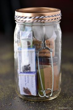 a glass jar filled with lots of different items