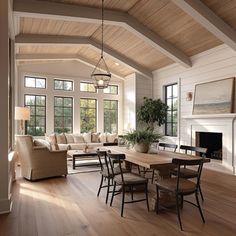 a living room filled with furniture and a fire place in the middle of a room