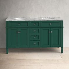 a green bathroom vanity with two sinks and marble counter top in front of a gray wall