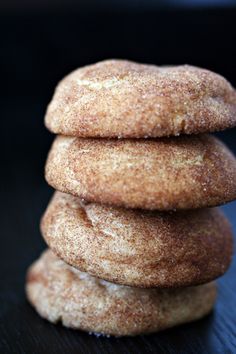 three sugar donuts stacked on top of each other