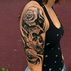 a woman's arm with a tattoo on it and an image of a skull