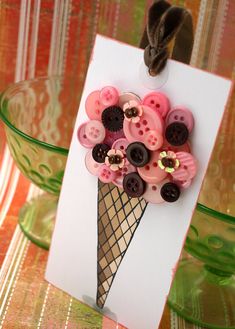 an ice cream cone with buttons attached to it