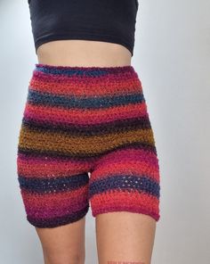 a close up of a person wearing colorful shorts