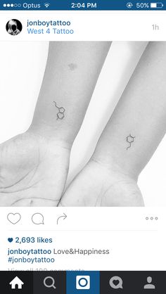 two small tattoos on the wrist are shown in black and white, while one has an apple