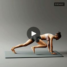 a woman is doing yoga on a mat