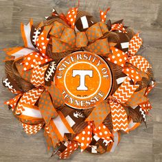 the university of tennessee football wreath is decorated with orange, white and brown chevrons