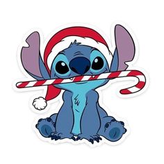 a sticker with a cartoon character holding a candy cane in it's mouth