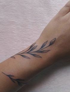 a woman's arm with a tattoo on it