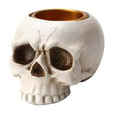 a white skull shaped vase with brown eyes