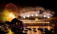 fireworks light up the night sky over sydney, australia's opera house and harbour