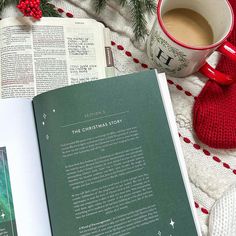 an open christmas story book next to a cup of coffee