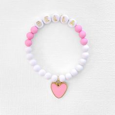 This pink and white heart charm bracelet makes a great gift! Gift this bracelet to someone you love💗 Personalize it with any name! 🤍 Please check sizing and spelling as all sales are final with personalized items. 🤍 The bracelets are beautifully packaged and ready to gift. Receipts are never included in your package. 🤍 Roll, don't pull. To avoid excess stretching please roll the bracelet on and off. Treat and store the bracelets gently. 🤍 Sizing options are just a guideline. Please make sur Toddler Bracelet, Make Your Own Bracelet, Valentines Bracelets, Girl Bracelet, Bracelet Heart, Name Bracelet, Bead Shop, Girls Necklaces, Measuring Tape