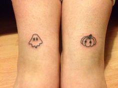 two small tattoos on both legs with pumpkins