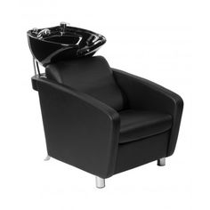 a black chair with a glass bowl on it's back and footrests