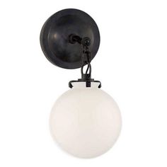 an old fashioned light fixture with a white glass ball hanging from it's side