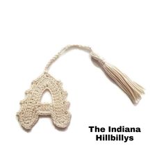 the indiana hillbilly's logo is shown on a white background with a tassel