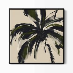 a black and white palm tree on a beige background framed in a black wooden frame