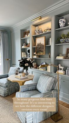 the living room is decorated in blue and gray tones, with an interesting pattern on the walls