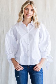 Our Cailin Balloon Sleeve Button Up in White is sure to turn heads! With its whimsical balloon sleeve design and delicate bows adorning the cuffs of the sleeves, this shirt is a showstopper. Perfect for any occasion, it's sure to keep you feeling stylish and chic! Sleeves Top, Ribbon Tie, Balloon Sleeves, Sleeve Designs, Sleeve Top, Button Up, Balloons, How Are You Feeling, Spring Summer