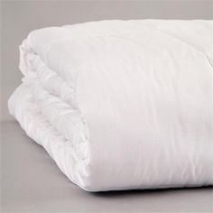 two white pillows stacked on top of each other