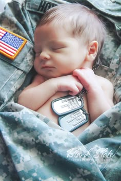 the baby is sleeping with his cell phone