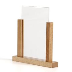 a wooden stand with a glass block on it's top and one piece of plexed wood sticking out of the bottom