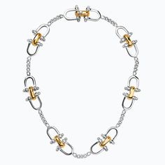 [especificaciones] Metal: Sterling silver with 23 karat yellow gold vermeil Dimensions: Length 17.3" Code: 01040300032 [/especificaciones][descripcion_producto]The Herencia Spurs Choker is part of a numbered limited edition of 80 units, made of sterling silver with 23 karat yellow gold vermeil. The versatile and timeless choker is made up of a series of equestrian-inspired elements interspersed by segments of silver chains. The modules, made by hand with a central articulation that allows the pe 80th Anniversary, Silver Chains, Gold Vermeil, Equestrian, Silver Chain, Limited Edition, Charm Bracelet, Yellow Gold, Sterling Silver