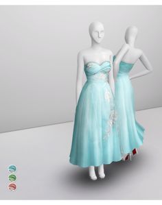 two mannequins dressed in blue dresses standing next to each other