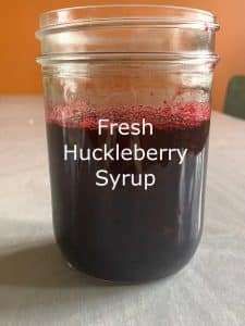 a jar filled with liquid sitting on top of a table