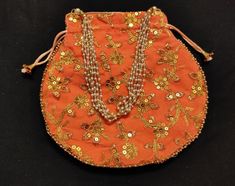 This is Indian Peach And Gold Colour Embroidered Decorative Handmade Potli Purse Bag Beaded Sequin Design Bag Uses With Designer Saree ,Wedding Gift ,Return Gift , Special Occasion . Length 22.5 CM Width   23 CM                                                                                                                                                                                                                     + This Potli Purse is Used For - Wedding dresses  Designer Sarees .                              +This Potli Purse is Used For -Clutches, Hand Bags .                                                         +This Potli Purse Used For- Handbags , Special Occasion ,Return Gift .                                                                      +This Potli Purse is Used For Potli Bags, Beautiful Embroidery, Birthday Dresses, Festival Wear, Beaded Chain, Designer Wedding Dresses, Saree Designs, Purses And Handbags, Special Occasion