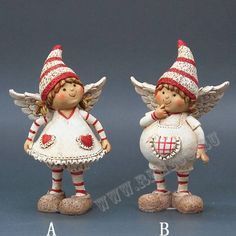 two small figurines with red and white hats