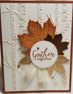 a card with leaves and the words gather together